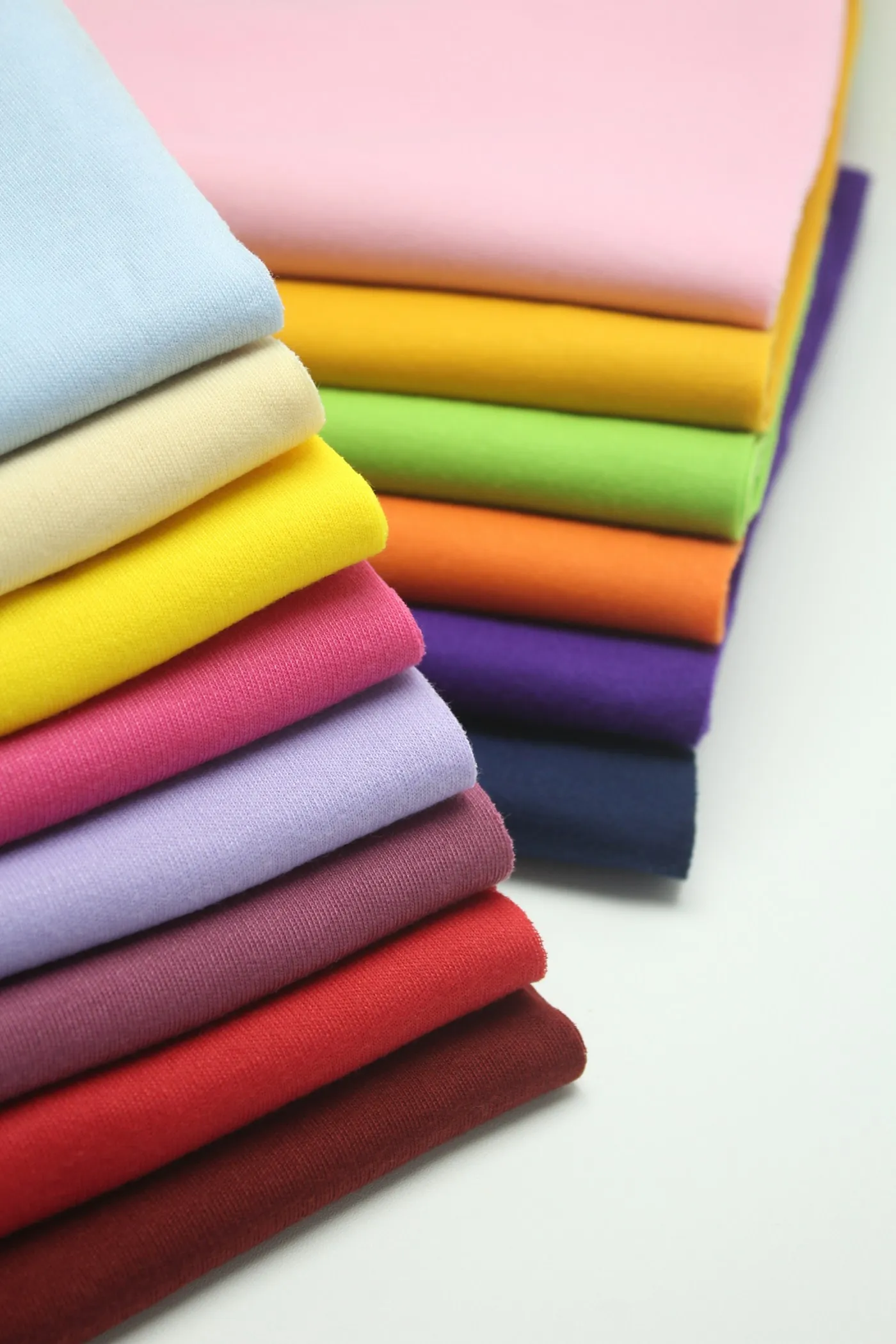 Coloured fabrics, folded and stacked